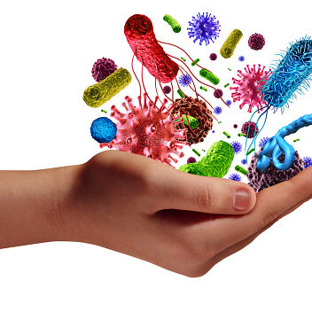 Health and disease risk medical health care concept with a human hand holding microscopic cancer virus and bacteria cells as a metaphor for pathogen illness with 3D illustration elements.